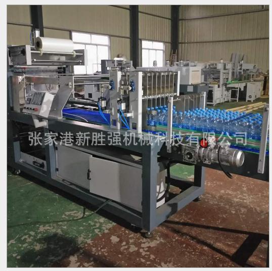 廠家直銷新勝?gòu)?qiáng) 閘門直線式膜包機(jī) 飲料瓶 自動(dòng)熱收縮膜包機(jī)