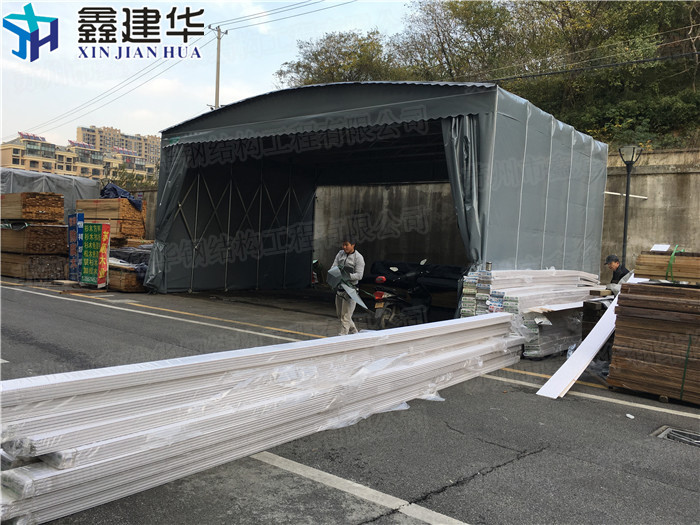 苏州市工厂电动大型移动推拉雨棚厂家平邑县活工厂电动大型移动推拉雨棚 鑫建华蓬业