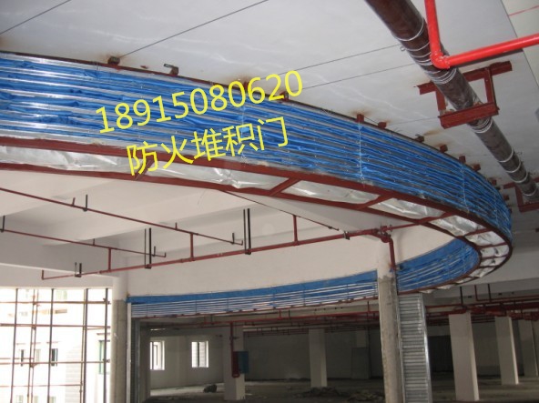 供應江蘇大學*的防火提升門生產廠家，江蘇學院最正規(guī)的堆積提升門施工廠家，江蘇大型超市*防火堆積門供貨施工廠家