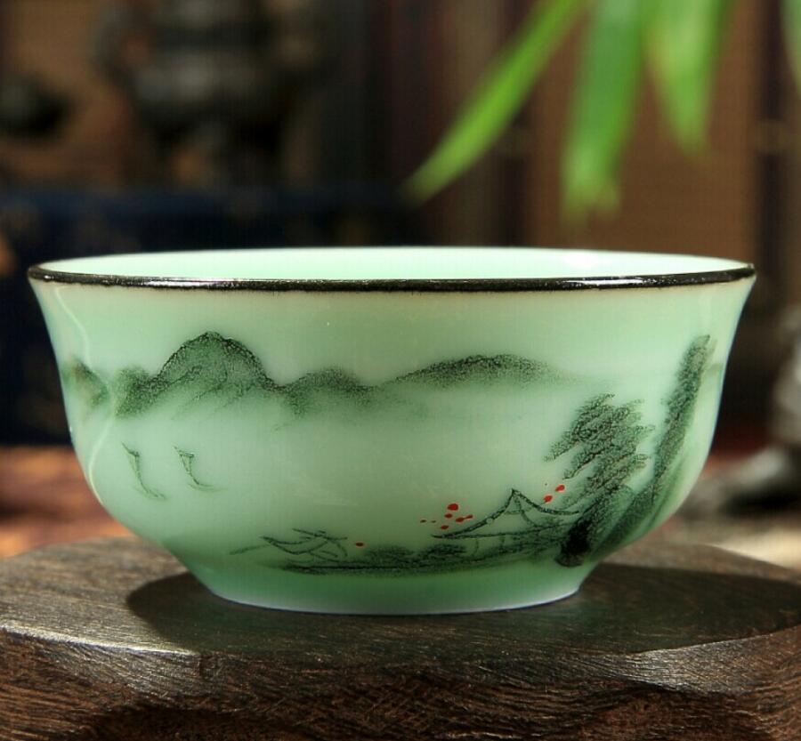 梅子青青瓷功夫茶具手彩手繪浮雕雙魚普洱茶杯創(chuàng)意水杯品茗杯 手繪浮雕雙魚茶杯