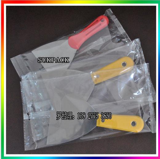 裝修鏟刀包裝機 油灰刀套膜機 三角刀套袋機 刮灰刀包裝機